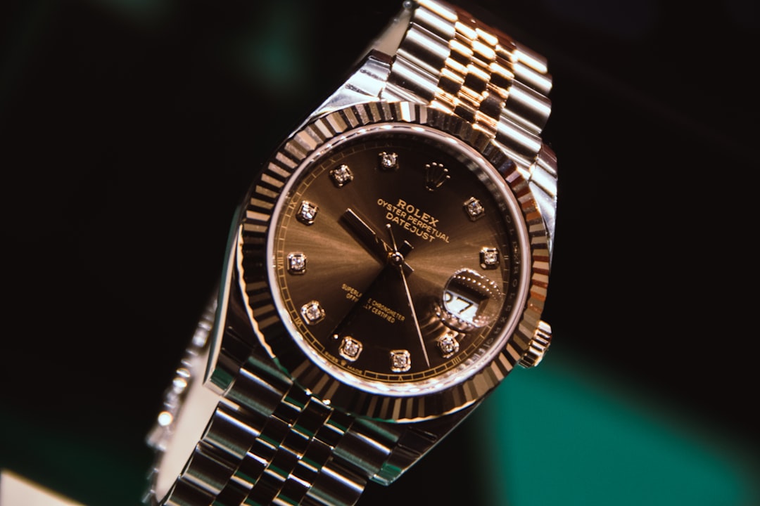 silver-and-gold-round-analog-watch-at-10-10-al6s6jpnzis